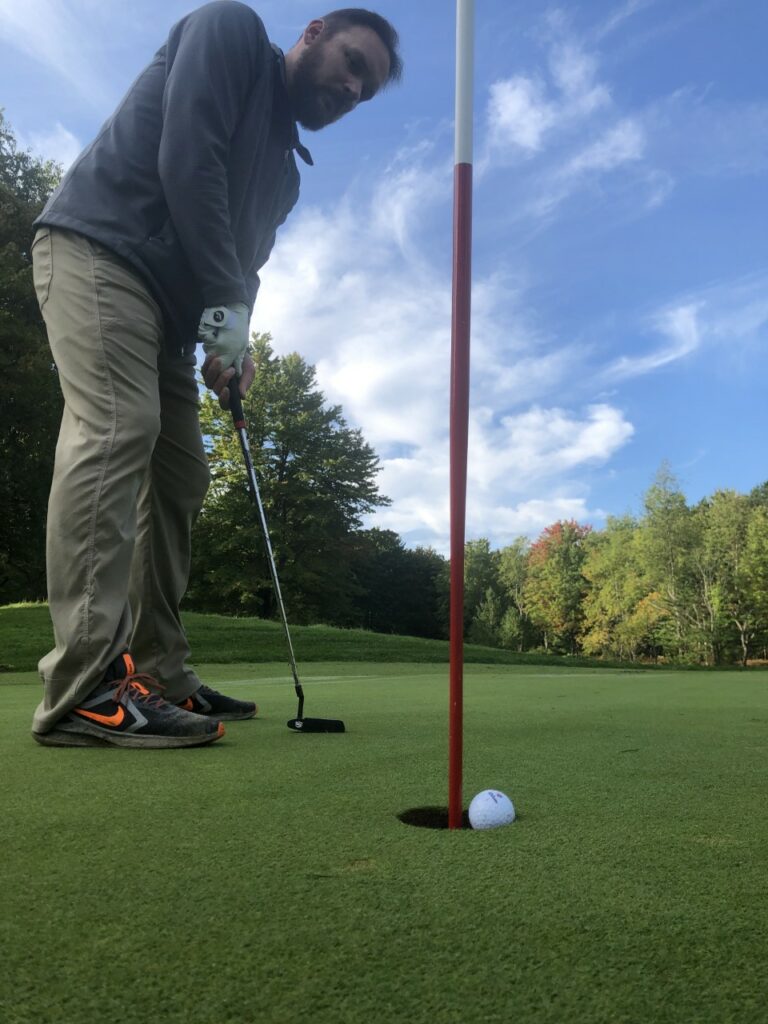A putt drops in on the Rick Smith Signature Course 